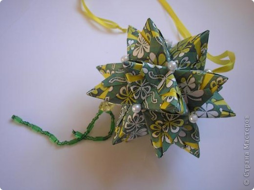 Кусудама Chandelle
Схемма здесь: http://goorigami.com/diagrams/chandelle-kusudama (фото 7)