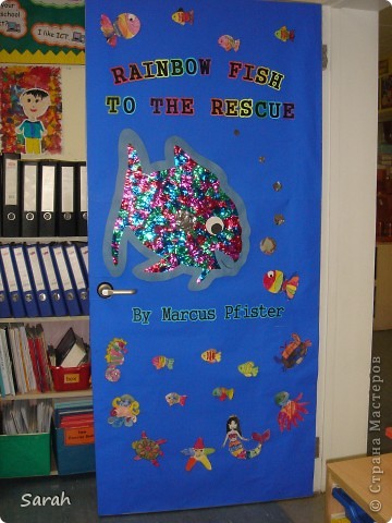 My Year 1-2 students read 'The Rainbow Fish to the Rescue' story and made their own book cover. The little fish was printed out and painted in water colour. The huge fish in the center was created together as a class. (фото 2)