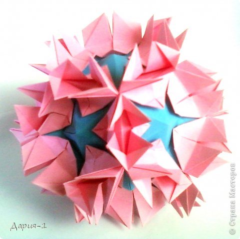 Name: Amazonia (Collection «Flowered Pyramids»)
Designer: Natalia Romanenko
Units: 30+12
Paper: 7.5*7.5 cm, 8.5*8.5 cm
Joint: no glue 
http://kusudama.info/2013/07/amazonia-tutorial/ (фото 10)